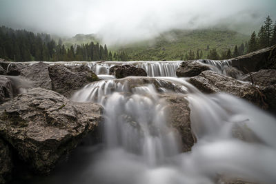 Scenic view of waterfall in forest