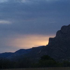 Scenic view of mountains against sky during sunset