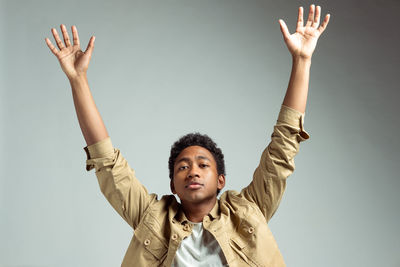 Portrait of young man against white background