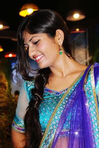 Smiling young woman in sari