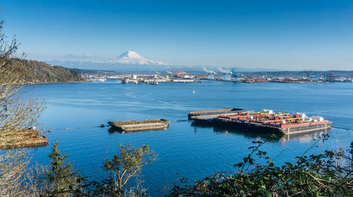 A view of the port of tacoma with mount rainier in the distance.