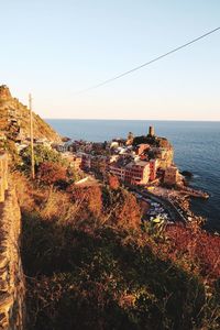 Panoramic view of sea and buildings against clear sky