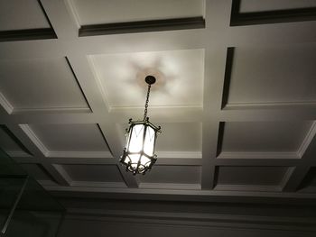 Low angle view of illuminated lights hanging from ceiling