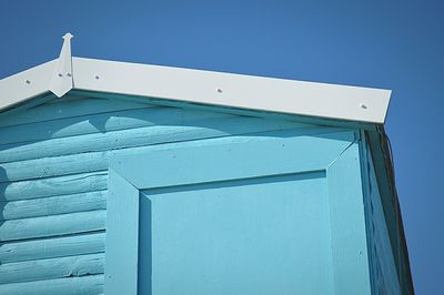 Low angle view of built structure against clear blue sky