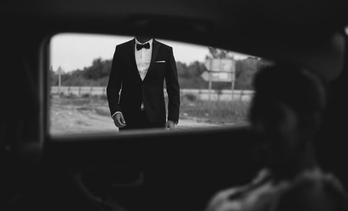 Reflection of woman in car window