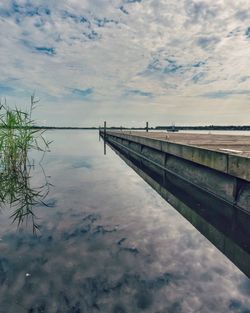 Bridge over sea against sky