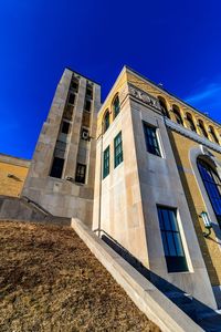 Low angle view of building against blue sky