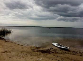 Scenic view of sea against cloudy sky