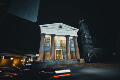 Low angle view of historical building at night