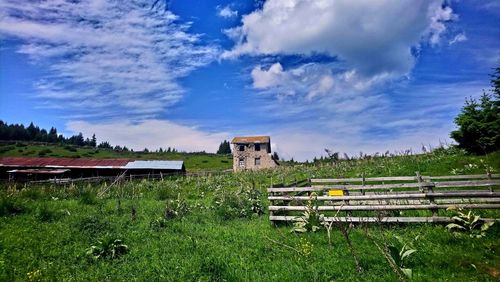 House on field against sky