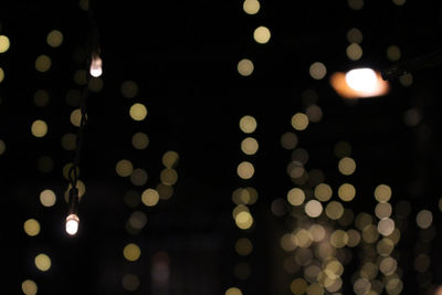 Defocused image of illuminated lights at night