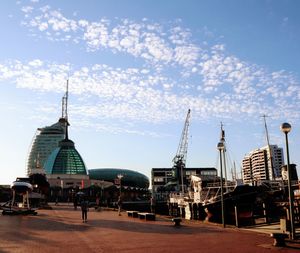 View of harbor against cloudy sky