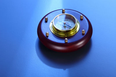 Close-up of navigational compass on table