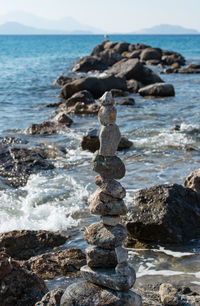 Stacked stones to the tower built on the beach of kos greece