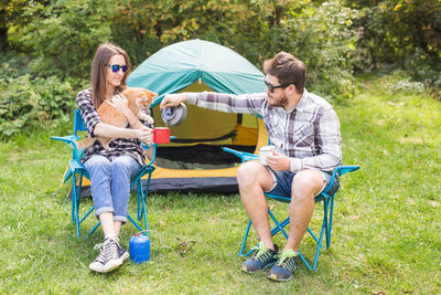 Young couple sitting on grass