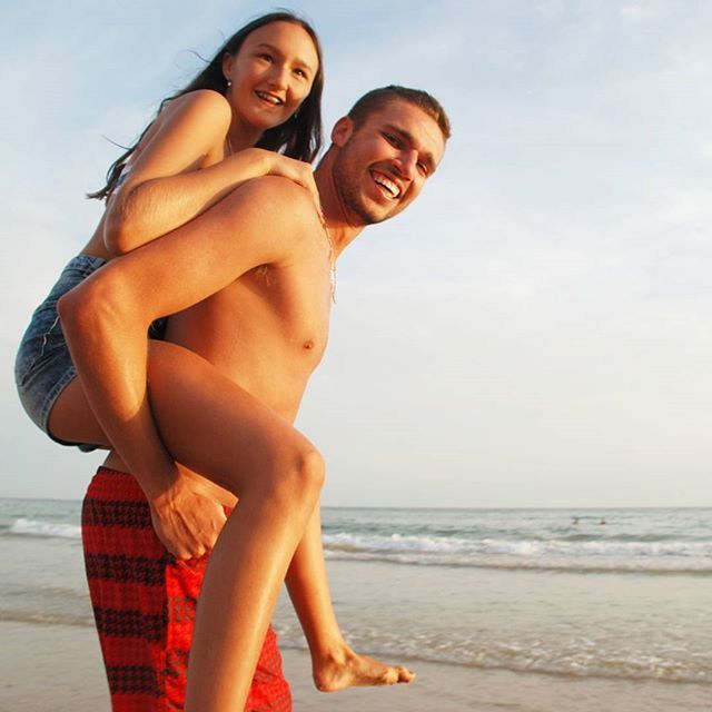 beach, sea, young adult, person, leisure activity, lifestyles, young women, horizon over water, water, full length, shore, vacations, sky, relaxation, sitting, sand, casual clothing, three quarter length