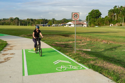 Woman riding a bike on a bike path