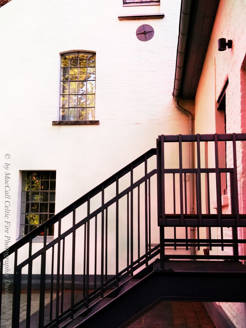 LOW ANGLE VIEW OF STAIRCASE BY BUILDING