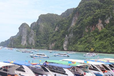 Scenic view of sea and mountains against sky