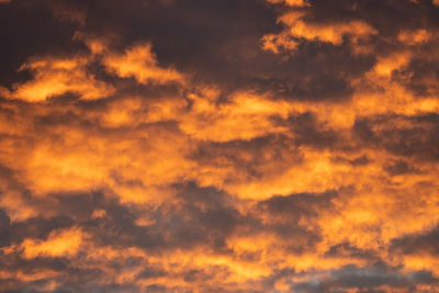Low angle view of orange cloudy sky