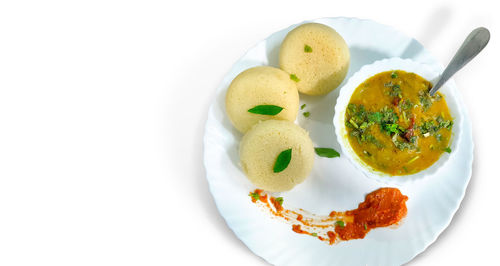 High angle view of food in plate on white background