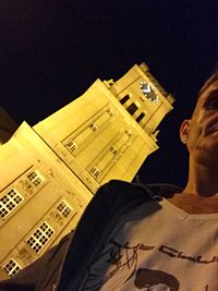 Woman standing against wall