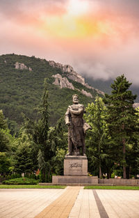 Statue against sky during sunset