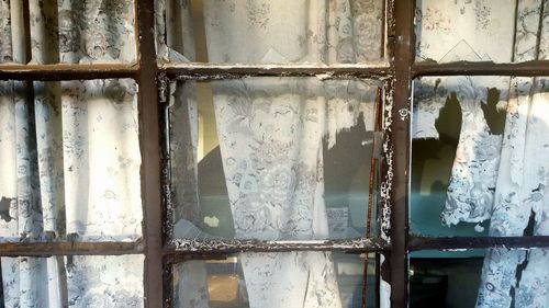 Full frame shot of rusty damaged window