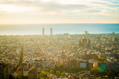 High angle view of city against sky during sunset