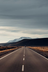 Empty road against sky