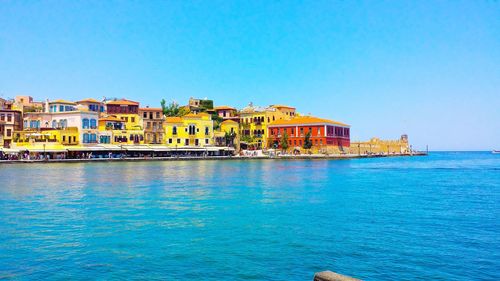 Scenic view of sea against clear blue sky