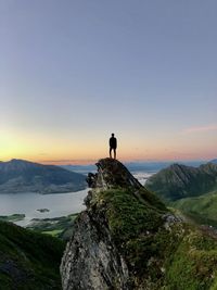 Standing on a mountain top at sundet in norway