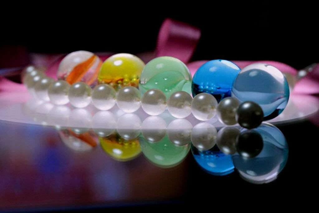 indoors, still life, close-up, table, multi colored, selective focus, variation, focus on foreground, glass - material, large group of objects, no people, arrangement, studio shot, in a row, reflection, group of objects, food and drink, colorful, transparent, freshness