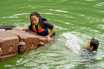 Young woman in boat on water