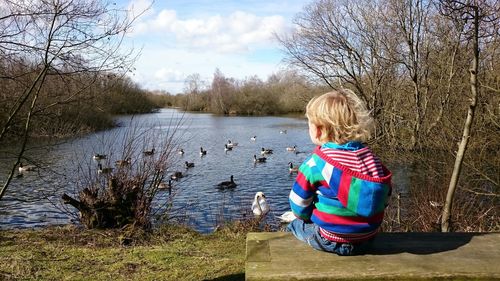 Man looking at lake