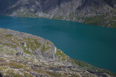 High angle view of lake by mountain