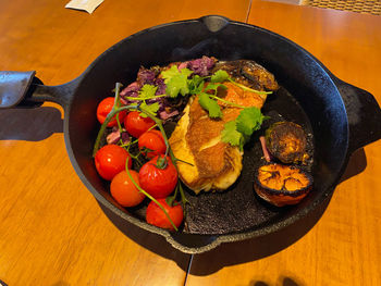 High angle view of fruits in plate on table