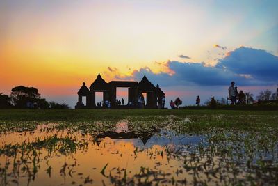 Scenic view of lake against sky during sunset