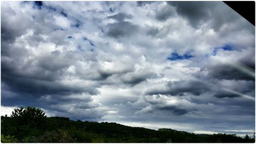 Scenic view of landscape against cloudy sky