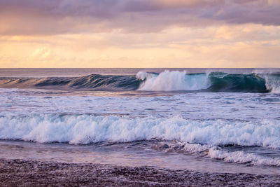 Waves in the atlantic ocean, before sunset, colorful sky, azores travel destination.