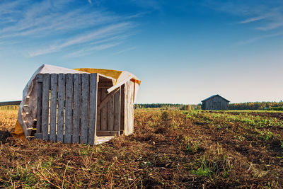 Fallen crates on an autumn field