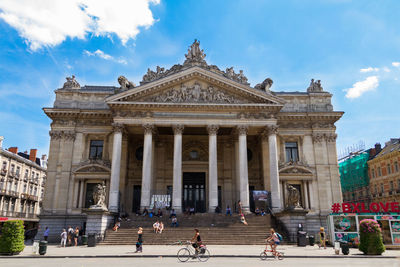 Low angle view of historical building against cloudy sky