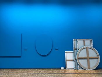 Blue wooden door with text on wall