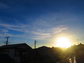 Silhouette buildings against sky during sunset