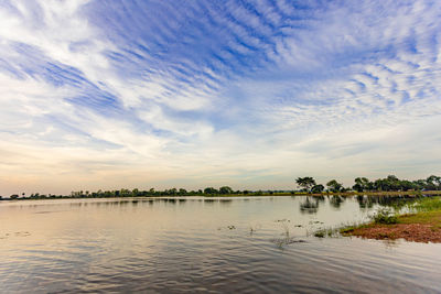 Scenic view of lake against sky during sunset