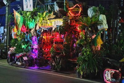 Illuminated market stall in city at night