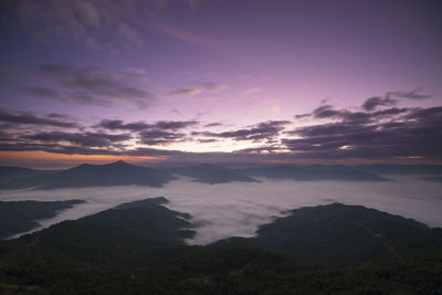 Scenic view of silhouette mountains against sky at sunset