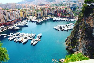 High angle view of sea and buildings in city