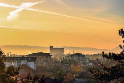 Cityscape against sky during sunset
