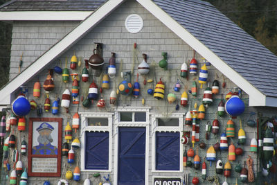 Multi colored balloons hanging on building